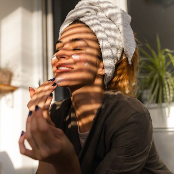 woman doing skin care routine at home