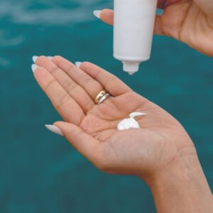 Applying sunscreen for healthy glowing summer skin in Nashua NH