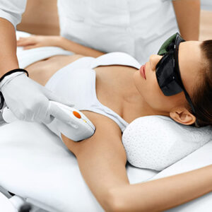 Woman receiving IPL permanent hair removal treatment