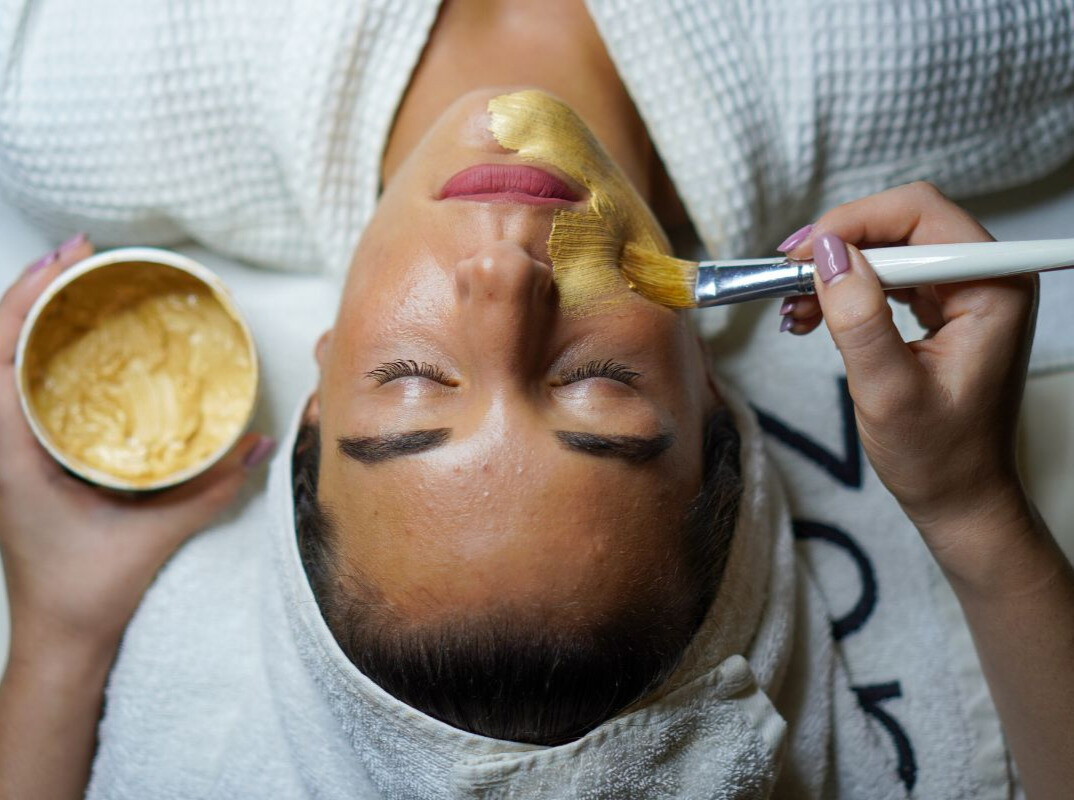 Woman getting facial treatment